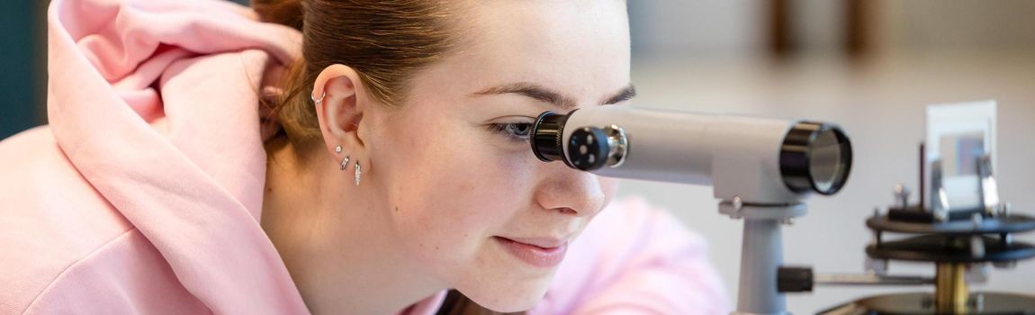 Student using a microscope