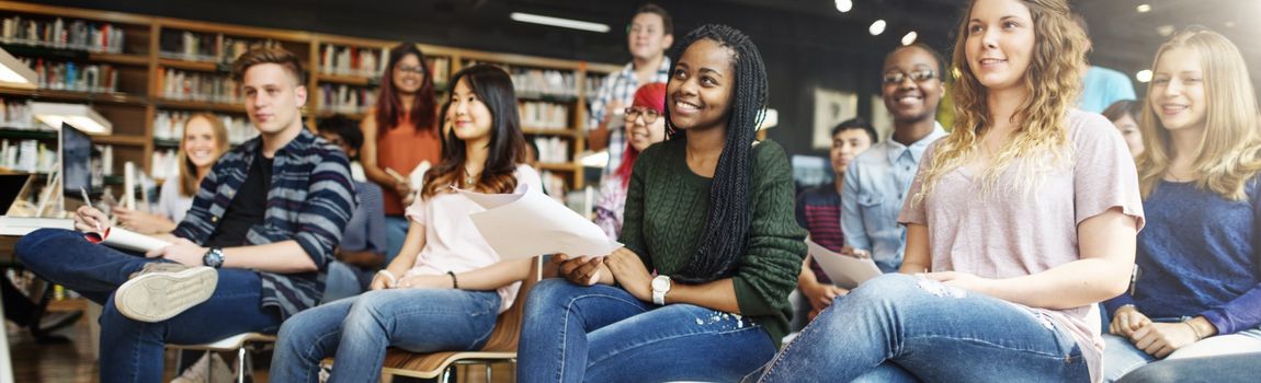 A group of mixed students sitting in a classroom