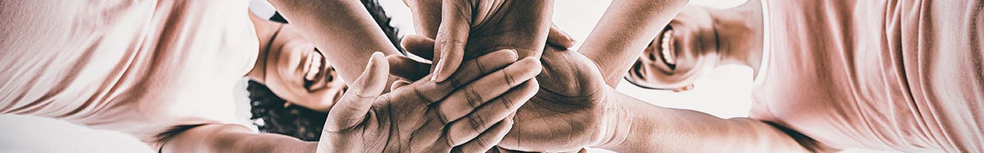 people joining hands together