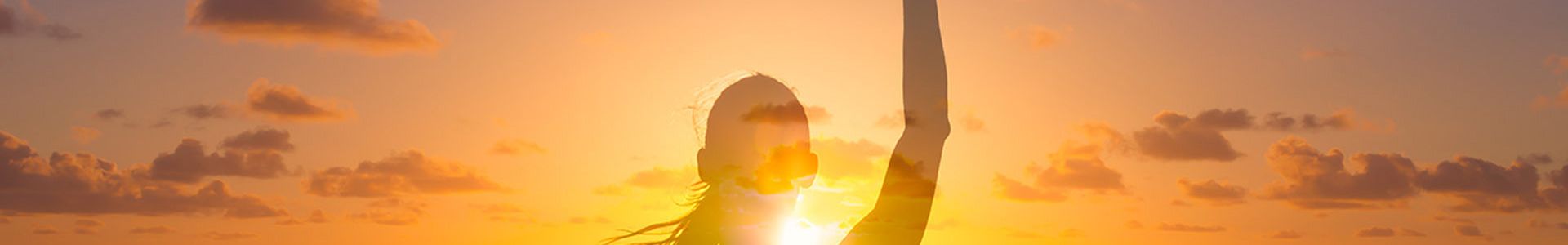 person standing in a sun drenched beach