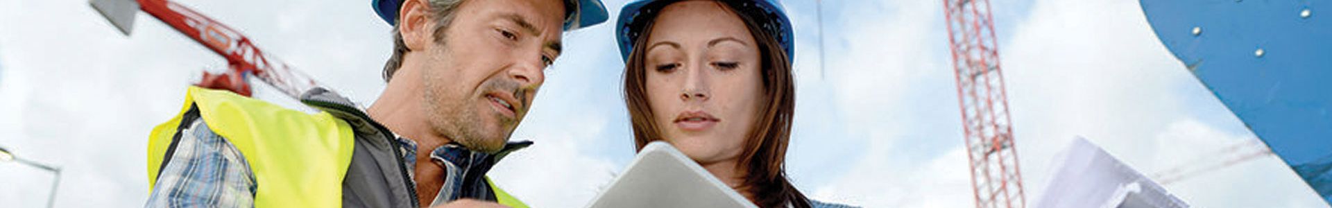 Construction students looking at documents