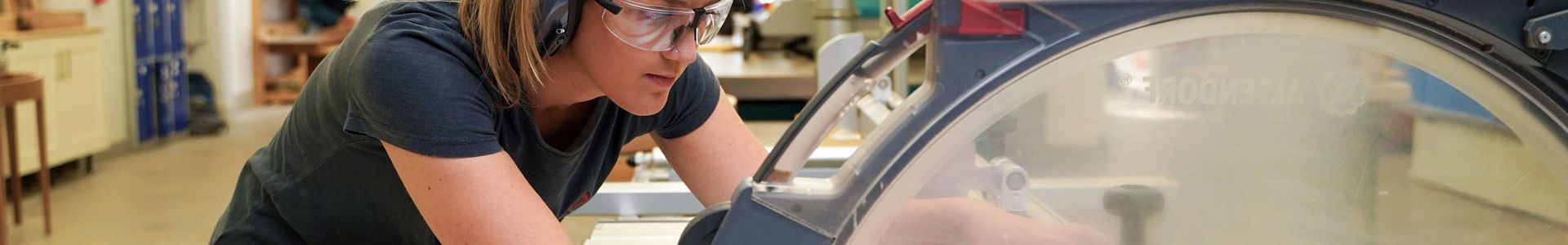Student cutting wood