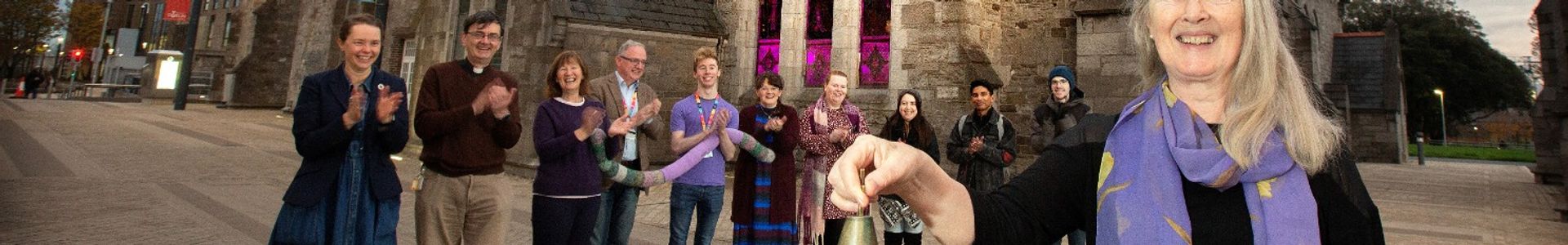 Staff members marking International Day of Persons with Disabilities, lighting St. Lawrence's church