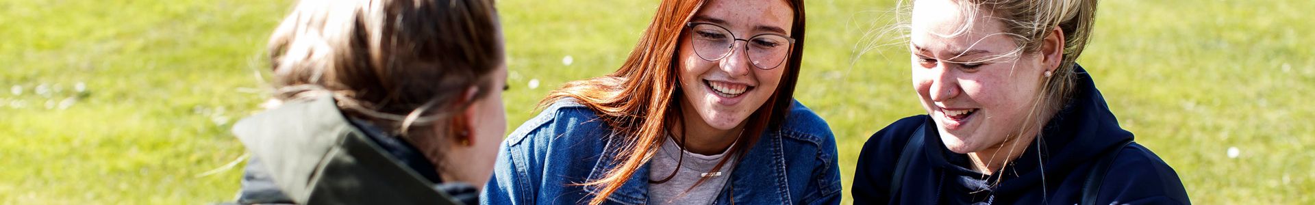 student group working on laptops