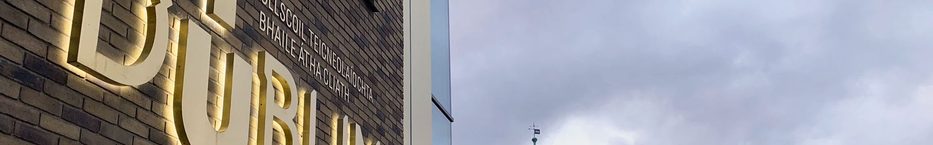TU Dublin logo brass sign on East Quad building