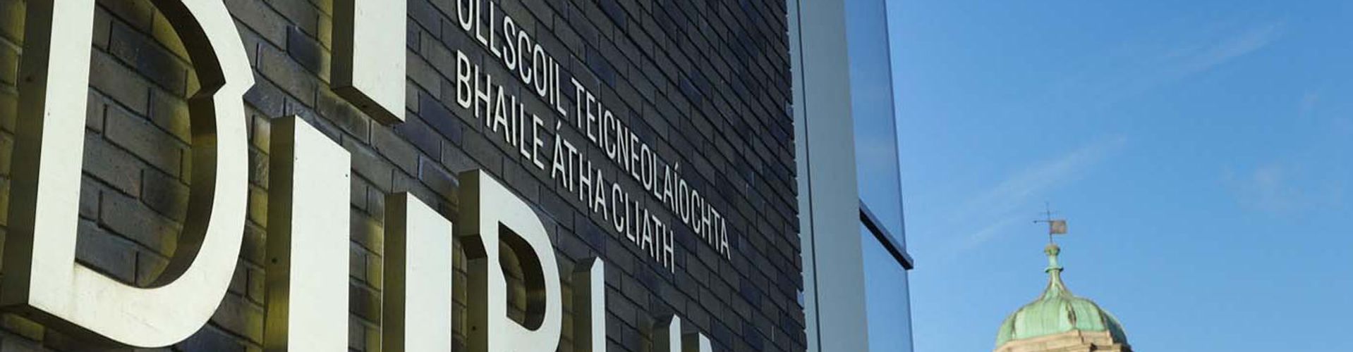 TU Dublin Brass sign east quad building Grangegorman clock tower in background