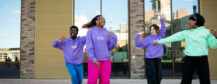 tu dublin students dancing in front of the East Quad building