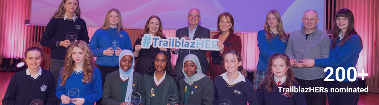 A group of students and ESB Representatives pose with cutouts at the TY TrailblazHER Awards