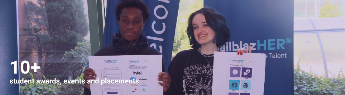 Two students pose with outline of App project for TrailblazHER final year projects