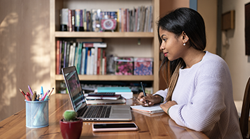 Girl at a laptop in a home setting