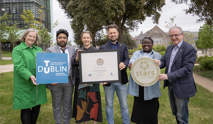 6 people standing outside holding awards and signs for a STARS award