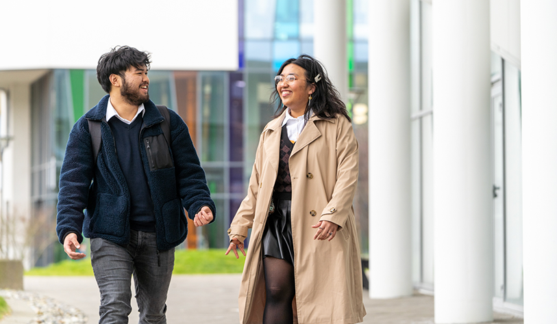 Walking on TU Dublin's campus blanchardstown with bright colour glass backdrop