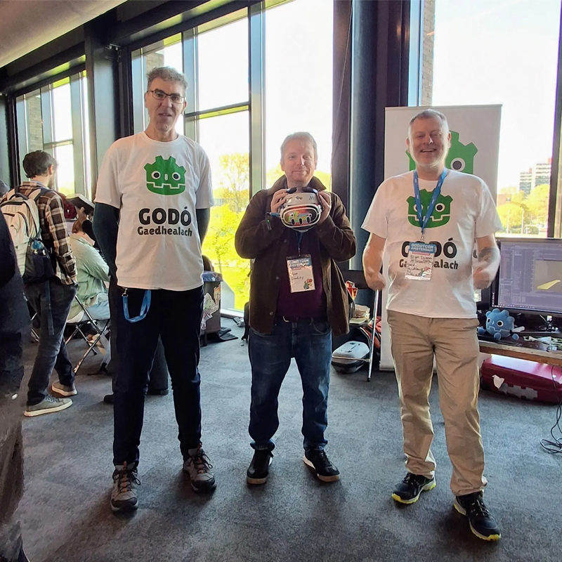 Three People Standing at a Conference