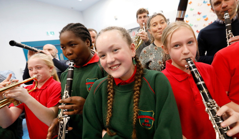 Students playing instruments at a workshop