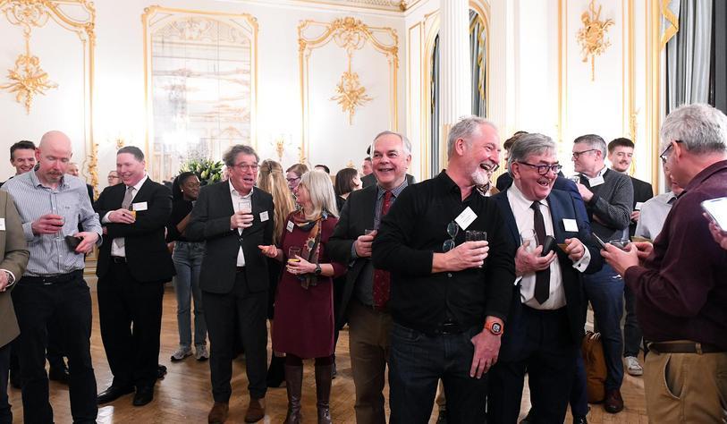 Graduates attend an alumni event in London