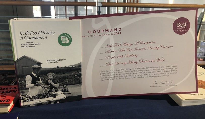 A photo of a book and an award parchment