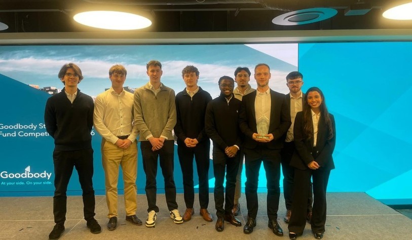 The winning team pose for a photo