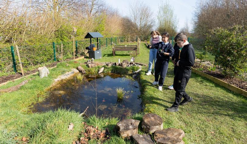 A group of young people working in a garden