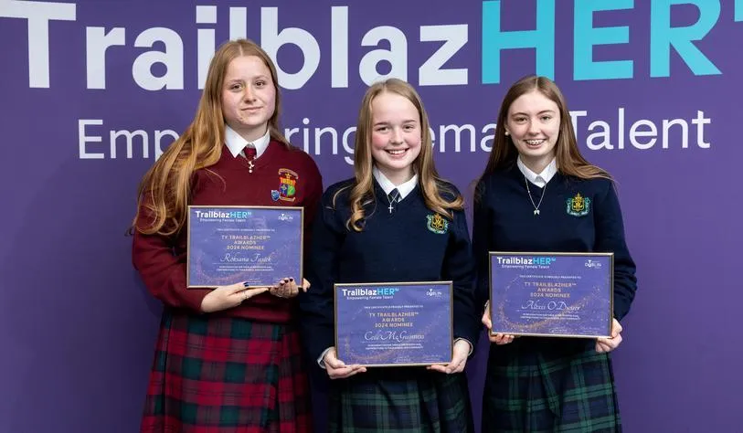 A group of young people holding certificates which say they are a TY TrailblazHER Award winner
